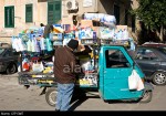 street-scene-man-selling-goods-in-a-mini-van-piaggio-ape-palermo-sicily-CRY3M7.jpg